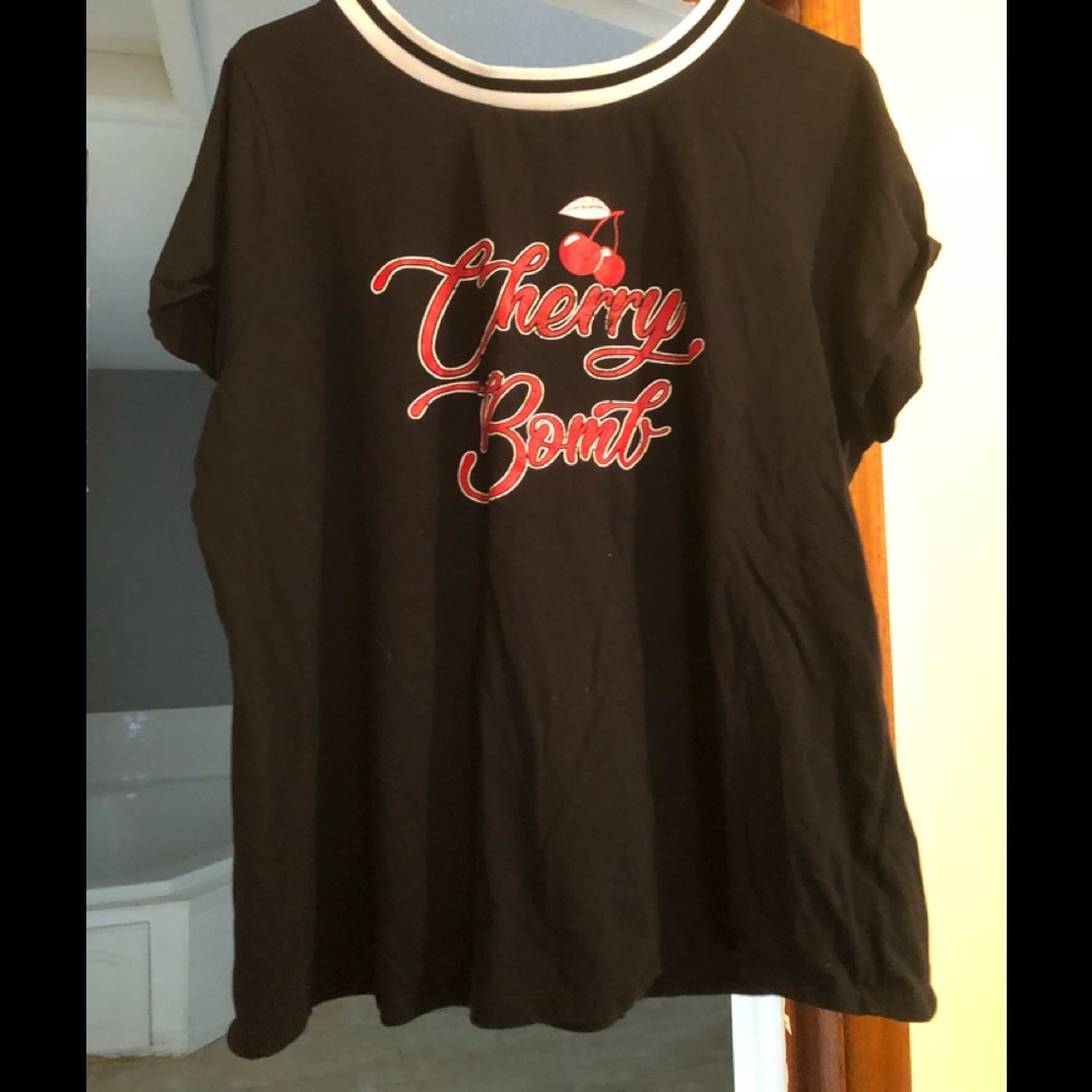 Short sleeve black tee with cherry bombs on front